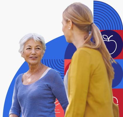 An older woman talks to younger woman.